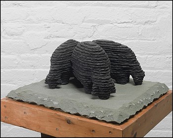 Boaz Vaadia Three Grazing Sheep (#132) (2014), bronze and bluestone sculpture, 6 x 14.5 x 13 inches. A layered stone depiction of three sheep grazing, representing natureâ€™s rhythm, pastoral serenity, and the balance between form and materiality.