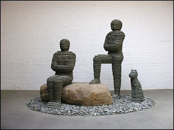 Boaz Vaadia Asa & Yehoshafat with Dog (#101) (2008), a monumental figurative sculpture made of bronze, bluestone, and boulders, featuring two stacked stone figures and a dog. This large-scale outdoor artwork reflects ancient techniques and modern abstract