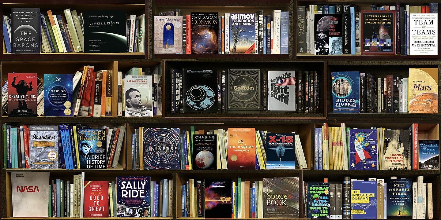 Max-Steven Grossman, Space; edition 1/5, 2021
diasec mounted photo, 37 x 75 inches / also available in 48 x 100 inches
"Space" (2021) by Max-Steven Grossman is a diasec-mounted photographic artwork, measuring 37 x 75 inches (Edition 1/5). Part of Grossman’s acclaimed "Bookscapes" series, this hyperreal bookshelf composition is meticulously curated with books on astronomy, space exploration, astrophysics, and the cosmos, featuring influential titles on NASA, Carl Sagan, Stephen Hawking, Apollo missions, space technology, and the history of interstellar travel.

Blending fine art photography, digital collage, and conceptual storytelling, Grossman creates an illusionary bookshelf that embodies the infinite curiosity of scientific discovery and human space exploration. Available exclusively at Sponder Gallery, Space is a collector’s must-have for those passionate about astronomy, science fiction, and the vast universe, making it an ideal statement piece for private collections, corporate offices, and contemporary interiors.

Max-Steven Grossman, contemporary fine art photography, Bookscape series, diasec-mounted photo, bookshelf illusion, space photography art, NASA artwork, astrophysics books, astronomy history artwork, conceptual photography, science fiction book art, statement piece for collectors, luxury interior artwork, investment-grade contemporary art, Sponder Gallery.

GROSS00531