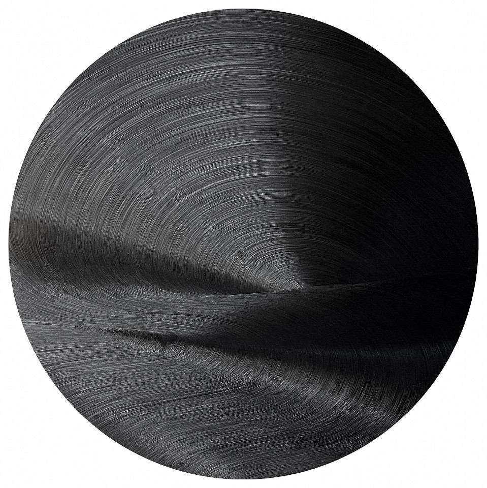 James Austin Murray, Serious Moonlight, 2021
Oil on panel, 60 x 60 in.
James Austin Murray’s Serious Moonlight (2021) is a captivating exploration of light, depth, and movement within the constraints of a monochromatic black palette. The circular oil painting radiates a hypnotic texture, with swirling brushstrokes that create an illusion of rippling waves and subtle luminescence. As light hits the surface, the oil reflects varying shades of black, transforming the work into a dynamic visual experience that shifts with the viewer’s perspective. Murray’s mastery of gesture and control over oil paint highlights his ability to create atmospheric tension and meditative calm simultaneously.

Inspired by the metaphysical properties of light and shadow, Serious Moonlight invites viewers to contemplate themes of infinity, the void, and the passage of time. The circular composition suggests cosmic energy or the orbit of celestial bodies, adding a symbolic layer to the piece’s tactile allure.

Perfect for collectors of minimalism and abstract expressionism, this painting exemplifies Murray’s unique contribution to contemporary monochrome painting.
MURR00031