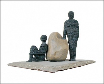Boaz Vaadia Ge'u'el & Binyamin (#73), a bronze and bluestone figurative sculpture featuring two human figures, one seated and one standing, positioned with a natural boulder between them, measuring 23 x 28 x 28 inches. This stacked stone artwork merges an