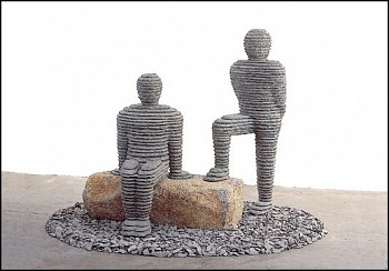 Boaz Vaadia Ammi'el & Amaryahu (#52) (1999), a large-scale figurative sculpture made of bronze, bluestone, and boulders. This dual-figure stacked stone artwork reflects ancient techniques and modern abstraction, available at Sponder Gallery.