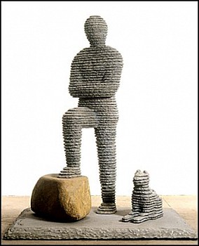 Boaz Vaadia Daniyyel with Dog (#28) (1996), a large-scale bronze and bluestone figurative sculpture featuring a standing figure with one foot on a boulder and a seated dog. This stacked stone artwork merges ancient techniques with modern abstraction, avai