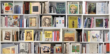 Photographic artwork titled Art MM (2024) by Max-Steven Grossman, a diasec-mounted fine art print (Edition 3/5, 37 x 75 in.), featuring a hyperreal bookshelf illusion with iconic art books and modern masters.