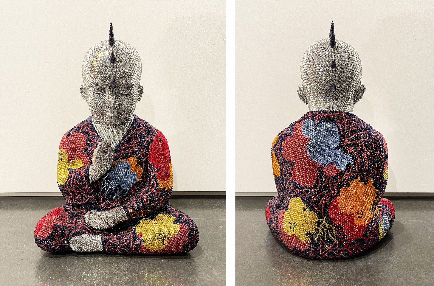 Metis Atash, Bloom and Beyond, 2025
Resin, acrylic paint and 28,000 Swarovski crystals, 17 x 12 x 7 in.
A cast resin Punk Buddha sculpture with imagery inspired by Andy Warol's Flowers series created using over 28,000 swarovski crystals 
ATAS00261
